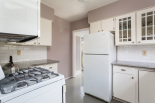 Kitchen, view towards back door, half bath and laundry