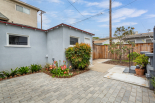 Garage, laundry room, and backyard