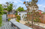 Back deck and backyard, view of laundry room