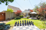 Chess set stays. View of back of house and garage