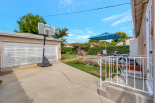 2 car garage, driveway and deck