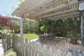 English garden landscaped backyard and Wisteria covered patio